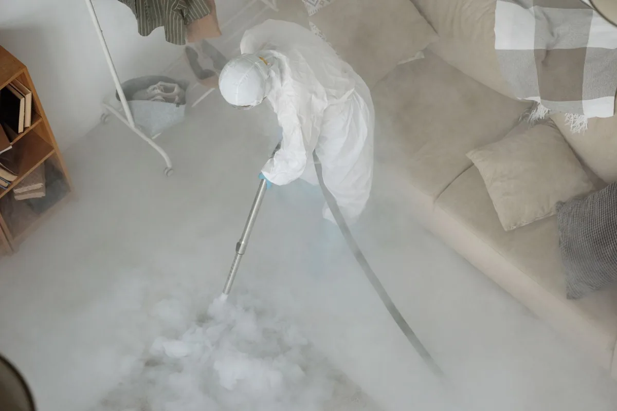 Biohazard cleanup technician in protective equipment, Cookeville, TN
